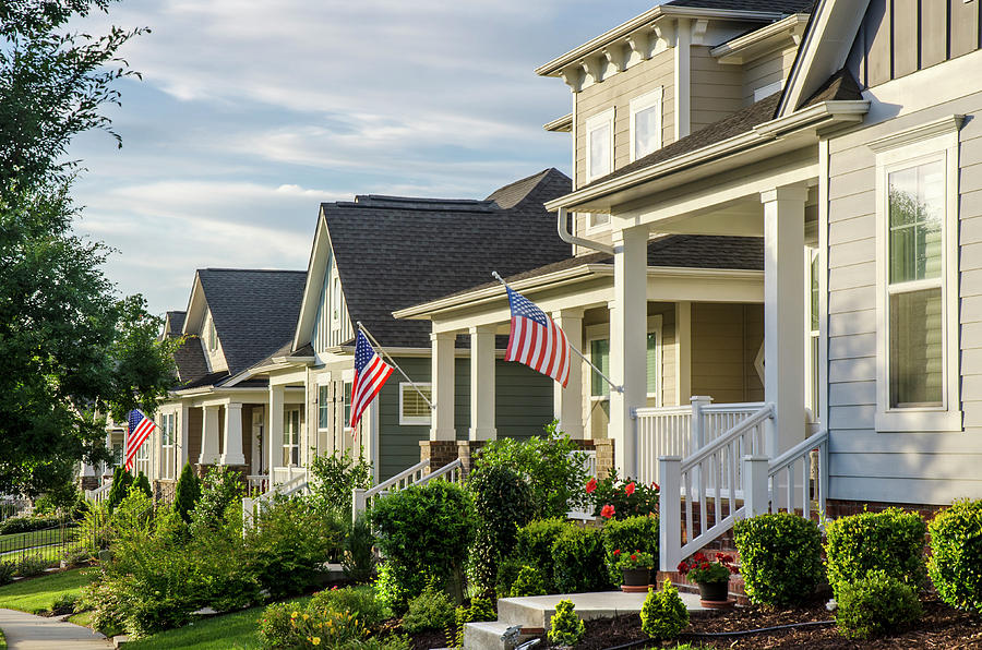 Homes near a military base with aircraft in the sky